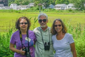 Jaye, Dan, and Ellen looking at mom and baby Osprey